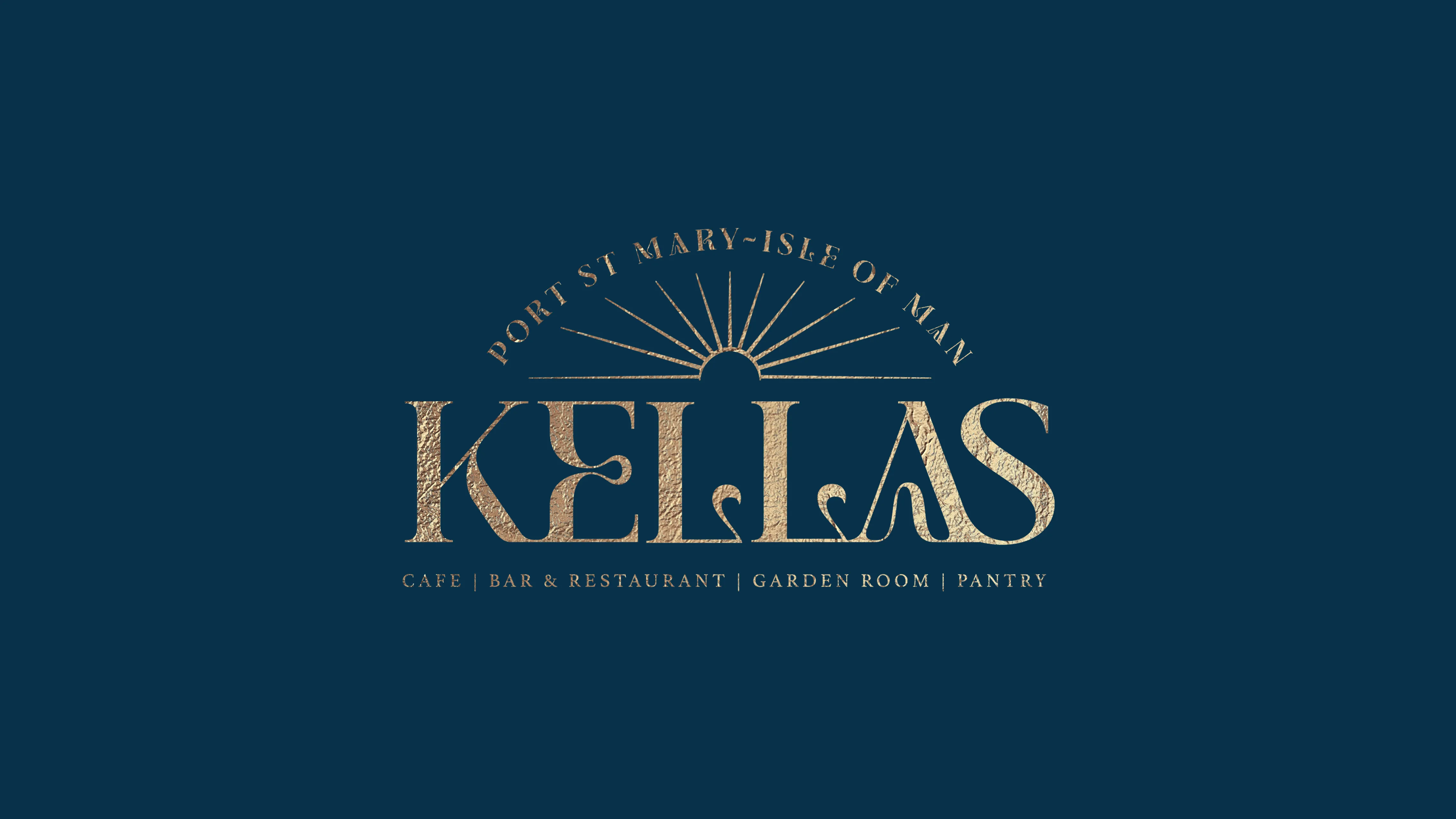The full Kella's primary logo displayed in gold on a dark teal background, featuring the wordmark "Kellas" with a sunburst above, the text "Port St Mary – Isle of Man" in an arc, and the tagline "Cafe | Bar & Restaurant | Garden Room | Pantry" beneath.